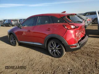 2018 Mazda CX-3 Grand Touring z VIN JM1DKFD79J0313779, wystawiony jako Copart lot #49120125 z przebiegiem 40 703 mil mil oraz Szkody całkowita. Historia ofert i sprzedaży dostępna na DreamBid. Obrazek 2.