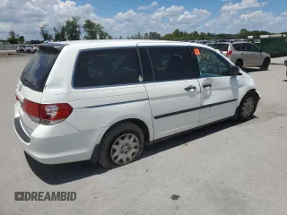 2010 Honda Odyssey LX with VIN 5FNRL3H23AB032112, listed as a Copart auction lot 60876035 with 223,335 mi miles and Salvage title. Bid and sale history available at DreamBid. Image 3.