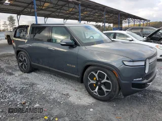 2023 Rivian R1S Launch Edition z VIN 7PDSGABL9PN022280, wystawiony jako Copart lot #83526124 z przebiegiem 51 mil mil oraz Szkoda całkowita • Salvage title. Historia ofert i sprzedaży dostępna na DreamBid. Obrazek 4.