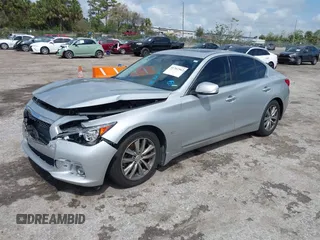 2014 Infiniti Q50 Premium z VIN JN1BV7AP9EM690381, wystawiony jako IAAI lot #41761562 z przebiegiem 107 099 mil mil oraz . Historia ofert i sprzedaży dostępna na DreamBid. Obrazek 2.