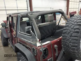 2007 Jeep Wrangler Unlimited Sahara z VIN 1J4GA59157L218278, wystawiony jako IAAI lot #41871773 z przebiegiem 145 992 mil mil oraz . Historia ofert i sprzedaży dostępna na DreamBid. Obrazek 13.