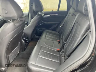 2021 BMW X3 M with VIN 5YMTS0C05M9G46973, listed as a IAAI auction lot 41334083 with 42,819 mi miles. Bid and sale history available at carsss.com. Image 7.