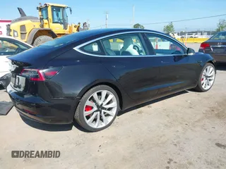 2019 Tesla Model 3 Long Range with VIN 5YJ3E1EB9KF231742, listed as a IAAI auction lot 42114608 with 86,657 mi miles and . Bid and sale history available at DreamBid. Image 4.