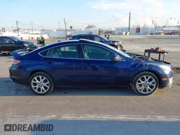 2009 Mazda 6 S Grand Touring with VIN 1YVHP82BX95M21357, listed as a IAAI auction lot 42013043 with 119,701 mi miles and . Bid and sale history available at DreamBid. Image 14.
