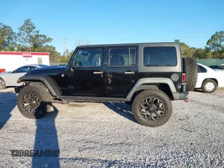 2015 Jeep Wrangler Unlimited Rubicon with VIN 1C4BJWFGXFL610153, listed as a IAAI auction lot 41575401 with 114,583 mi miles. Bid and sale history available at carsss.com. Image 14.