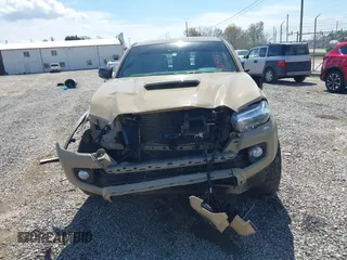 2020 Toyota Tacoma SR5 z VIN 3TMCZ5AN1LM300447, wystawiony jako IAAI lot #41961434 z przebiegiem 42 090 mil mil oraz . Historia ofert i sprzedaży dostępna na DreamBid. Obrazek 12.