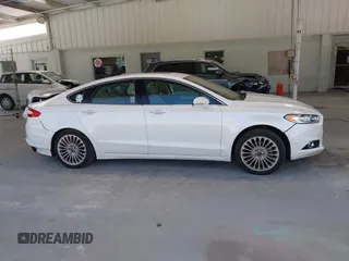 2016 Ford Fusion Titanium with VIN 3FA6P0K96GR390989, listed as a IAAI auction lot 42634275 with 123,559 mi miles and . Bid and sale history available at DreamBid. Image 13.