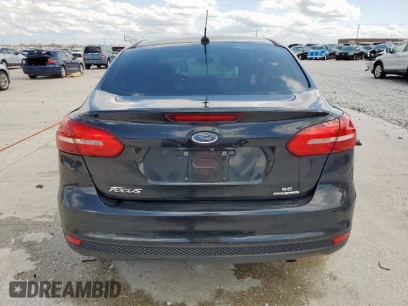 2015 Ford Focus SE with VIN 1FADP3F23FL242768, listed as a Copart auction lot 58068865 with 172,163 mi miles and Salvage title. Bid and sale history available at DreamBid. Image 6.