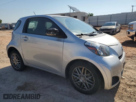 2012 Scion iQ with VIN JTNJJXB05CJ010539, listed as a Copart auction lot 56489245 with 114,623 mi miles and Salvage title. Bid and sale history available at DreamBid. Image 4.