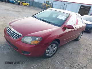 2009 Kia Spectra EX with VIN KNAFE221095634712, listed as a IAAI auction lot 41930897 with 165,185 mi miles. Bid and sale history available at carsss.com. Image 2.