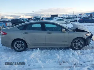 2016 Ford Fusion SE Hybrid with VIN 3FA6P0LU8GR127311, listed as a IAAI auction lot 41242945 with 1 mi miles. Bid and sale history available at carsss.com. Image 14.