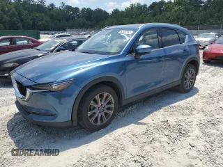 2019 Mazda CX-5 Grand Touring with VIN JM3KFADM2K0605769, listed as a Copart auction lot 63468165 with 36,821 mi miles and Salvage title. Bid and sale history available at DreamBid. Image 1.