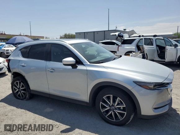 2018 Mazda CX-5 Grand Touring with VIN JM3KFBDM0J0377243, listed as a Copart auction lot 62199295 with 37,930 mi miles and Salvage title. Bid and sale history available at DreamBid. Image 4.