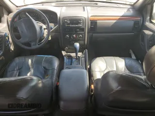 1999 Jeep Grand Cherokee Laredo с VIN 1J4G258S8XC735159, выставлен на аукционе Copart как лот 56247505 с пробегом 241 636 миль миль и Списание • Salvage title. История ставок и продаж доступна на DreamBid. Изображение 8.