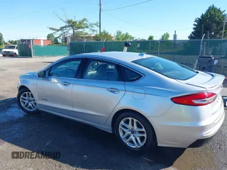 2019 Ford Fusion Titanium with VIN 3FA6P0RUXKR141565, listed as a IAAI auction lot 42323999 with 206,397 mi miles and . Bid and sale history available at DreamBid. Image 3.