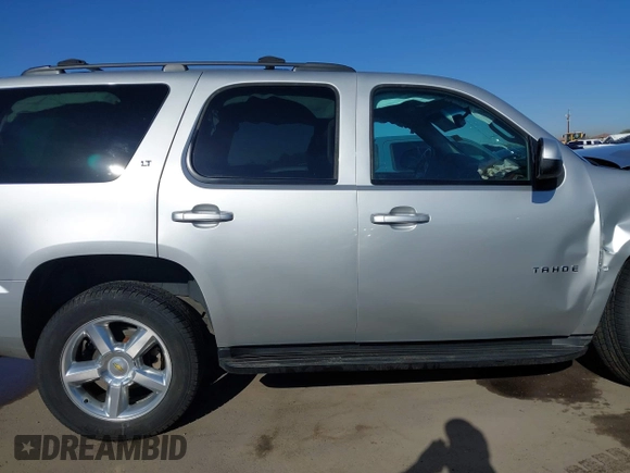 2013 Chevrolet Tahoe LT with VIN 1GNSKBE01DR157083, listed as a IAAI auction lot 41759189 with 153,403 mi miles and . Bid and sale history available at DreamBid. Image 14.