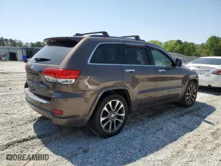 2017 Jeep Grand Cherokee Overland with VIN 1C4RJECG1HC868559, listed as a Copart auction lot 52569595 with 168,226 mi miles and Clean Title. Bid and sale history available at carsss.com. Image 3.