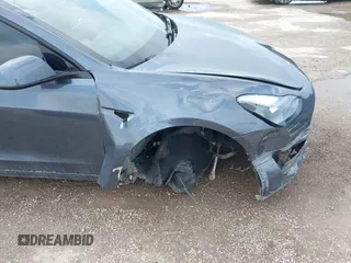 2023 Tesla Model 3 with VIN 5YJ3E1EA5PF676316, listed as a IAAI auction lot 42384765 with 33,715 mi miles and . Bid and sale history available at DreamBid. Image 6.