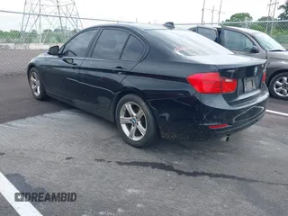 2015 BMW 3 Series 320i with VIN WBA3B1G57FNT05826, listed as a IAAI auction lot 42103193 with 128,800 mi miles. Bid and sale history available at carsss.com. Image 3.