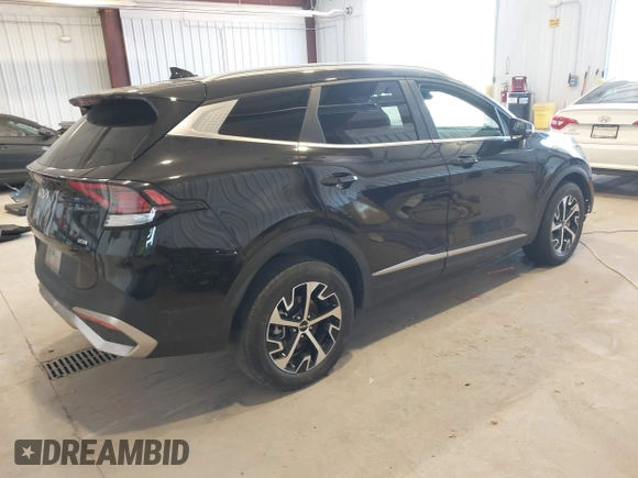 2023 Kia Sportage EX with VIN KNDPVCAG8P7095454, listed as a IAAI auction lot 42335661 with 96,718 mi miles and . Bid and sale history available at DreamBid. Image 4.