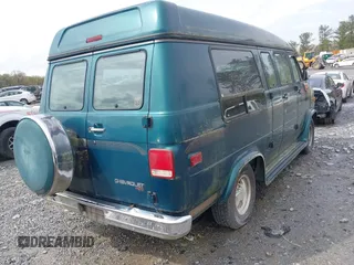 1995 Chevrolet Chevy Van z VIN 1GBEG25K0SF243254, wystawiony jako IAAI lot #41915622 z przebiegiem 74 262 mil mil oraz . Historia ofert i sprzedaży dostępna na DreamBid. Obrazek 4.