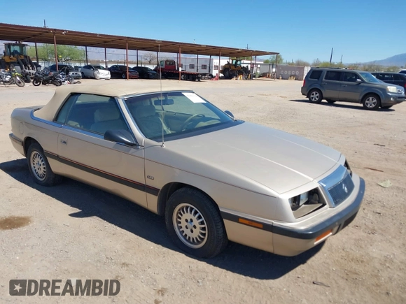1992 Chrysler LeBaron z VIN 1C3XU4532NF283782, wystawiony jako IAAI lot #41841326 z przebiegiem 99 528 mil mil oraz . Historia ofert i sprzedaży dostępna na DreamBid. Obrazek 1.