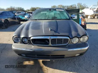 2004 Jaguar XJ VDP with VIN SAJWA74C54SG18384, listed as a Copart auction lot 83081974 with 141,664 mi miles and Salvage Title. Bid and sale history available at carsss.com. Image 5.