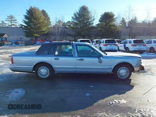1997 Lincoln Town Car Cartier with VIN 1LNLM83W9VY661126, listed as a IAAI auction lot 41456847 with 160,710 mi miles and . Bid and sale history available at DreamBid. Image 13.