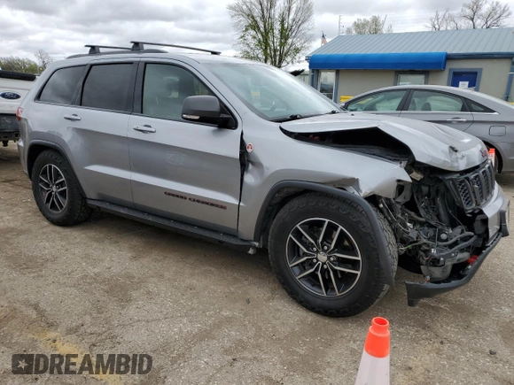 2018 Jeep Grand Cherokee Trailhawk with VIN 1C4RJFLG8JC164774, listed as a Copart auction lot 51699845 with 104,467 mi miles and Salvage title. Bid and sale history available at DreamBid. Image 4.