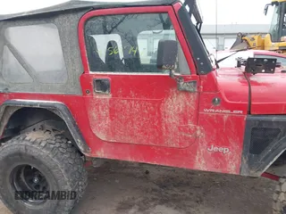 2002 Jeep Wrangler X z VIN 1J4FA39S52P708519, wystawiony jako IAAI lot #41569747 z przebiegiem 219 168 mil mil oraz . Historia ofert i sprzedaży dostępna na DreamBid. Obrazek 13.