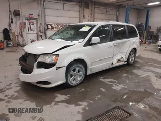 2012 Dodge Grand Caravan SXT with VIN 2C4RDGCG3CR405373, listed as a IAAI auction lot 41264407 with 164,019 mi miles and . Bid and sale history available at DreamBid. Image 2.