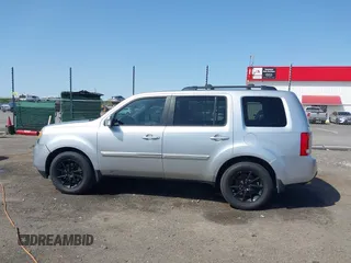 2013 Honda Pilot Touring with VIN 5FNYF3H95DB032438, listed as a IAAI auction lot 41865938 with 298,973 mi miles and . Bid and sale history available at DreamBid. Image 14.