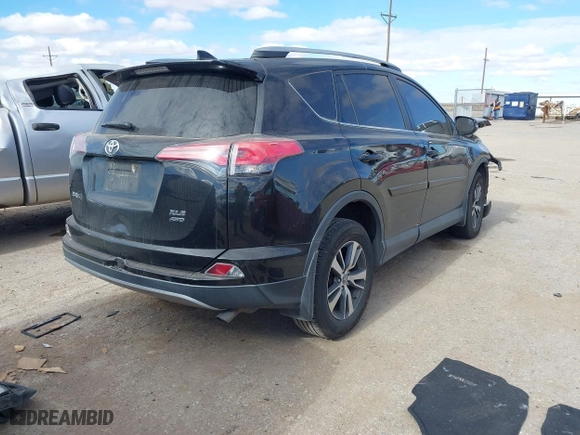 2017 Toyota RAV4 XLE with VIN 2T3RFREV9HW567801, listed as a IAAI auction lot 41053316 with 103,267 mi miles. Bid and sale history available at carsss.com. Image 4.