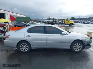 2003 Lexus ES 300 with VIN JTHBF30G830130603, listed as a IAAI auction lot 41849482 with 212,667 mi miles. Bid and sale history available at carsss.com. Image 13.
