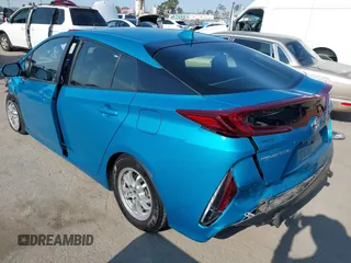 2022 Toyota Prius LE with VIN JTDKAMFP8N3209977, listed as a IAAI auction lot 42777763 with 52,995 mi miles and . Bid and sale history available at DreamBid. Image 3.