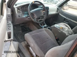 1999 Ford Explorer Sport z VIN 1FMYU22X9XUC03819, wystawiony jako Copart lot #69840564 z przebiegiem 214 315 mil mil oraz Szkoda całkowita • Salvage title. Historia ofert i sprzedaży dostępna na DreamBid. Obrazek 8.
