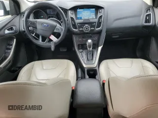 2016 Ford Focus Titanium z VIN 1FADP3N23GL345904, wystawiony jako Copart lot #60139525 z przebiegiem 97 572 mil mil oraz Szkoda całkowita • Salvage title. Historia ofert i sprzedaży dostępna na DreamBid. Obrazek 8.