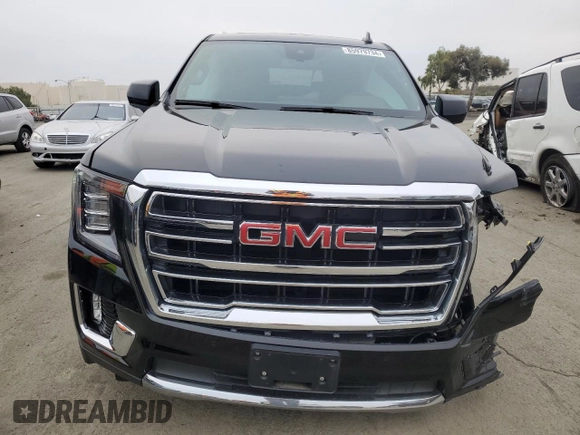 2023 GMC Yukon XL SLT with VIN 1GKS2GKD5PR363433, listed as a Copart auction lot 85979734 with 61,957 mi miles and Salvage Title. Bid and sale history available at DreamBid. Image 5.