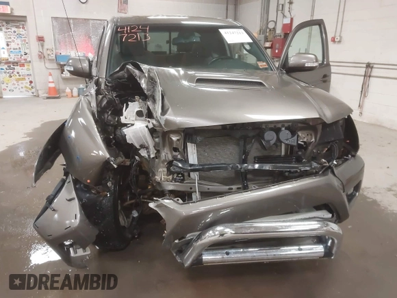 2013 Toyota Tacoma with VIN 5TFUU4EN3DX055489, listed as a IAAI auction lot 41247213 with 58,570 mi miles and . Bid and sale history available at DreamBid. Image 6.