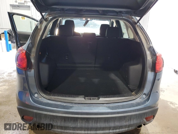 2015 Mazda CX-5 Sport with VIN JM3KE4BY9F0552942, listed as a Copart auction lot 54750245 with 129,700 mi miles and Salvage title. Bid and sale history available at DreamBid. Image 6.