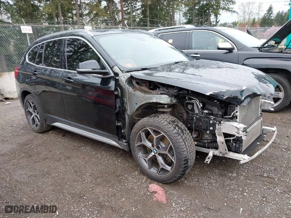 2018 BMW X1 xDrive28i with VIN WBXHT3C39J3H30531, listed as a IAAI auction lot 41890734 with 59,147 mi miles. Bid and sale history available at carsss.com. Image 1.