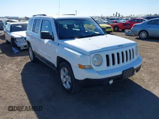 2011 Jeep Patriot Latitude with VIN 1J4NT1GB0BD105816, listed as a IAAI auction lot 41330180 with 143,431 mi miles. Bid and sale history available at carsss.com. Image 1.