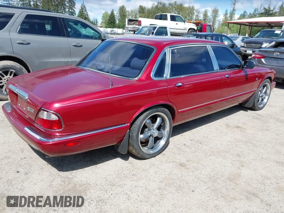 1998 Jaguar XJ Vanden Plas with VIN SAJKX6249WC844067, listed as a IAAI auction lot 42145235 with 117,142 mi miles and . Bid and sale history available at DreamBid. Image 4.