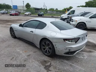 2013 Maserati GranTurismo Sport with VIN ZAM45VLA8D0072490, listed as a IAAI auction lot 42438872 with 84,214 mi miles and . Bid and sale history available at DreamBid. Image 3.