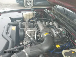 2000 Land Rover Discovery Cloth z VIN SALTY1247YA241984, wystawiony jako IAAI lot #42889095 z przebiegiem 140 936 mil mil oraz . Historia ofert i sprzedaży dostępna na DreamBid. Obrazek 13.