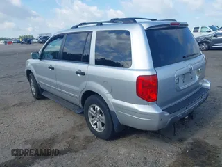 2005 Honda Pilot EX-L z VIN 2HKYF18665H558980, wystawiony jako IAAI lot #42316215 z przebiegiem 207 288 mil mil oraz . Historia ofert i sprzedaży dostępna na DreamBid. Obrazek 3.
