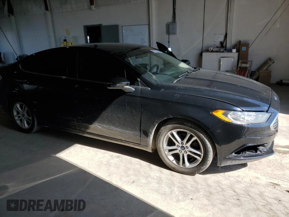 2018 Ford Fusion SE z VIN 3FA6P0HDXJR130677, wystawiony jako Copart lot #51737345 z przebiegiem 129 918 mil mil oraz Szkoda całkowita • Salvage title. Historia ofert i sprzedaży dostępna na DreamBid. Obrazek 4.