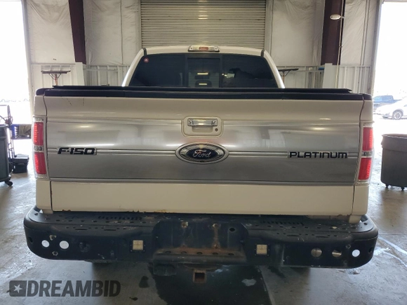 2014 Ford F-150 XL with VIN 1FTFW1ETXEFB39719, listed as a Copart auction lot 62073335 with 124,643 mi miles and Salvage title. Bid and sale history available at DreamBid. Image 6.