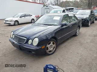 2002 Mercedes-Benz E-Class AWD with VIN WDBJF83J32X068355, listed as a IAAI auction lot 41872613 with 143,501 mi miles. Bid and sale history available at carsss.com. Image 2.