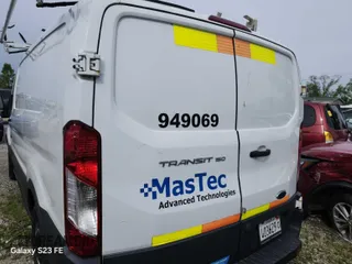 2016 Ford Transit Cargo with VIN 1FTYE1ZM5GKA76148, listed as a IAAI auction lot 42299673 with 150,587 mi miles and . Bid and sale history available at DreamBid. Image 6.